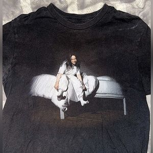 Billie Eilish black t-shirt with design on front “BILLIE EILISH” wording on back